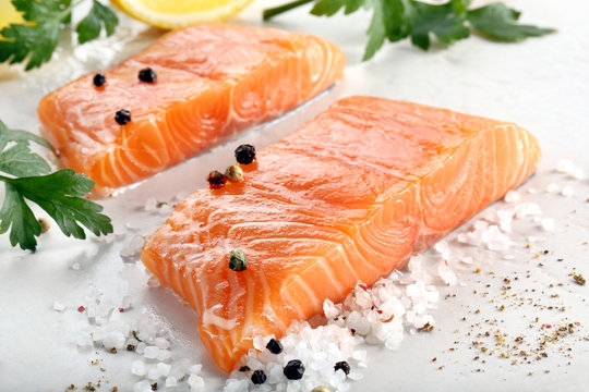 Raw salmon fillet with herbs and spices
