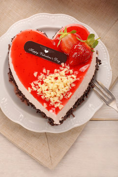 Delicious cream cake in shape of heart