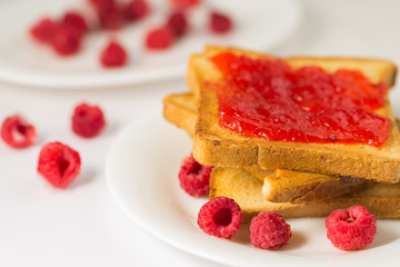 Toast with jam in white plate