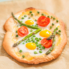 Spring pizza with vegetables and eggs