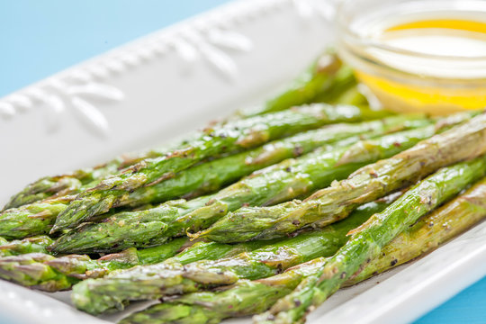Fototapeta Roasted Asparagus on a White Plate