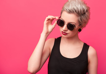 summer portrait of an attractive young woman in sunglasses
