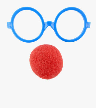 Basic goofy face elements: plastic blue play glasses and red foam clown nose. Isolated.