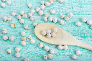 spilled chickpeas on a wooden background