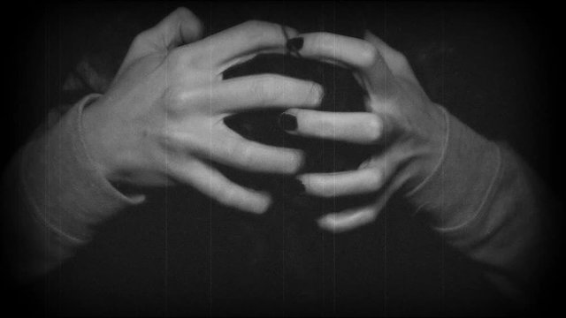 Crazy woman scratching her head with black hair. Macro shot.