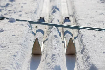Foto op Plexiglas Skis travel tourism. Cross-country skiing equipment on snow field. Healthy lifestyle wintersport © SrjT