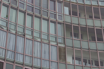 rounded industrial old building wall with urban windows background