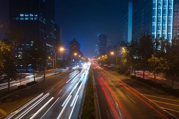 Fototapeta na wymiar Light trails on motorway highway at night