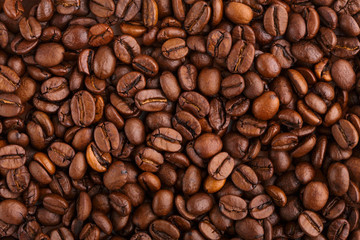 roasted coffee beans isolated in white background. Roasted coffee beans background close up. Coffee beans pile from top on white background with copy space for text. Good morning.