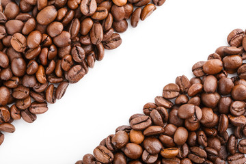 roasted coffee beans isolated in white background. Roasted coffee beans background close up. Coffee beans pile from top on white background with copy space for text. Good morning.