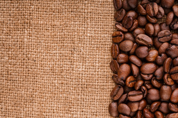 coffee beans on burlap background. roasted coffee beans isolated in white background. Roasted coffee beans background close up. Coffee beans pile from top on white background with copy space for text