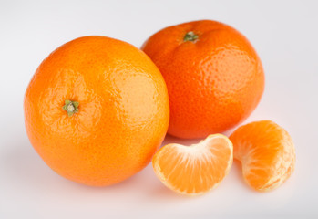 Ripe mandarin close-up on a white background. Tangerine orange. Colorful Food and drink still life concept. Fresh fruits and vegetables on color background. Clementine. Citrus. Fresh fruits. Diet.