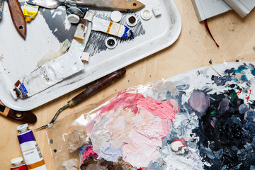 Painter table with paints, brushes