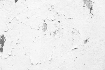 Weathered and peeled off light gray concrete wall in black&white.