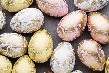 Easter eggs painted in colors on a pattern background.