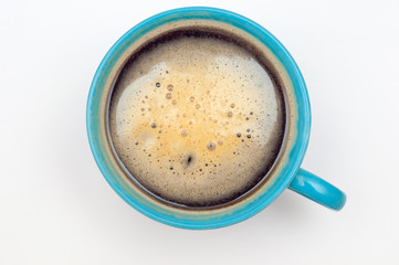 Blue cup of coffee. Espresso isolated on white, top view.