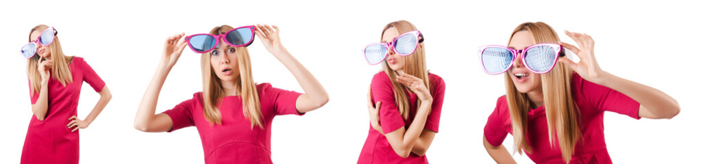 Tall model with giant sunglasses on white