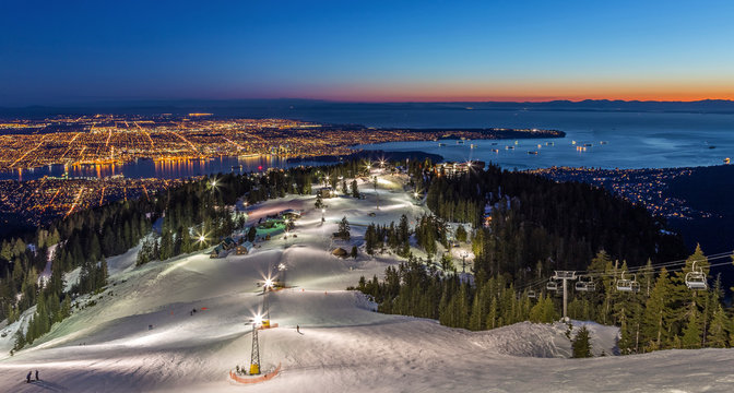 Grouse Mountain ski resort with a beautiful view of Vancouver city, British Columbia, at dusk
