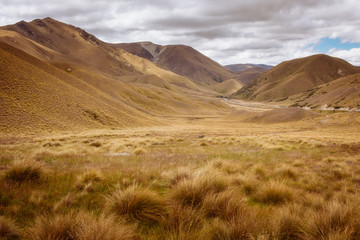 Landscape view of meadows and hills at Lindis Pass, NZ