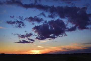 Fototapeta na wymiar Sunset with Purple Clouds