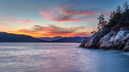 Naklejka premium Sunset on the Pacific Northwest Coastline, Taken from Lighthouse Park, British Columbia, Canada