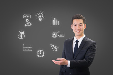 Success businessman showing business icon and chart concept