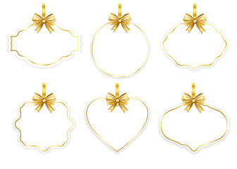 Obraz premium Paper white frame set with gold bow isolated on white background. Vector illustration.