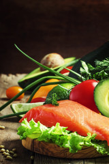 Ingredients for salad with smoked salmon and avocado, foods are