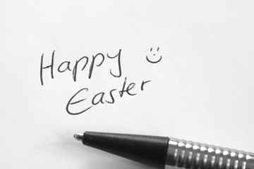Handwritten Happy Easter congratulation on white paper