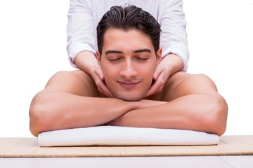 Obraz na płótnie Canvas Handsome man during spa massaging session