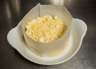 Mozzarella and cheddar cheese mixed pate, ready for making into macaroni and cheese.