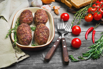 Meat cutlets on ceramic dish