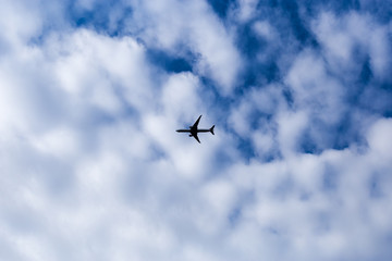 Naklejka na ściany i meble aeroplane with cloudy background