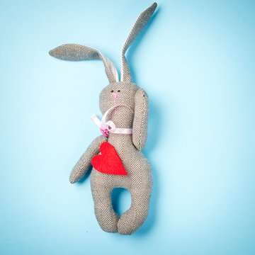 Easter bunny on a blue background. Rabbit. Easter ideas. Space for text. Happy easter.
