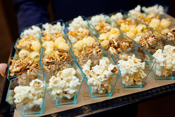popcorn cups on a tray in the cinema
