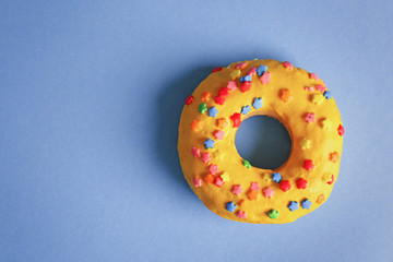 Glazed donut on color background