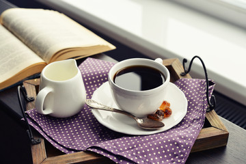 Cup of coffee on vintage tray