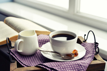 Cup of coffee on vintage tray