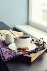 Cup of coffee on vintage tray