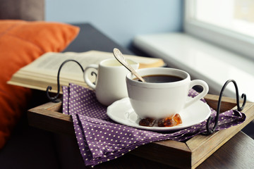 Cup of coffee on vintage tray