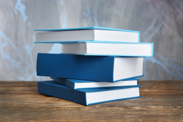 Stack of books on light background