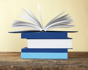 Stack of books on yellow background