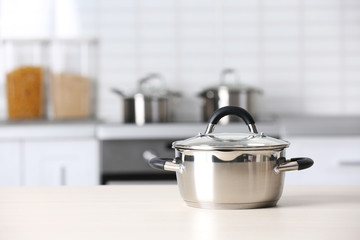 Metal pan on kitchen counter © Africa Studio