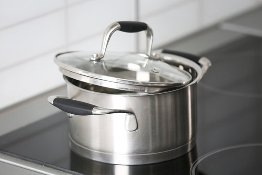 Metal pan on kitchen stove, closeup