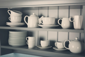 Kitchen shelves with white rustic dinnerware