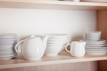 Fototapeta na wymiar Kitchen cupboard with nice rustic dinnerware