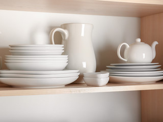 Fototapeta na wymiar Kitchen cupboard with nice rustic dinnerware