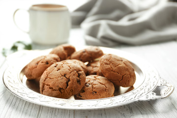 Tray with tasty homemade cookies on kitchen table, closeup