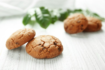 Delicious coffee cookies on wooden table