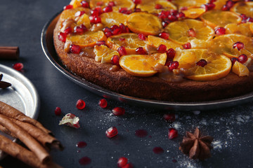 Freshly baked delicious tangerine pie on kitchen table